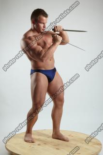 ADAM_WARD STANDING WITH TWO DAGGERS